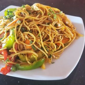 A plate of vegetable and pepper noodles.